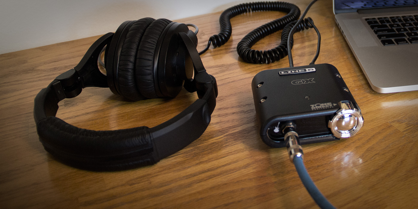 Line 6 POD Studio GX recording interface plugged into a laptop and headphones