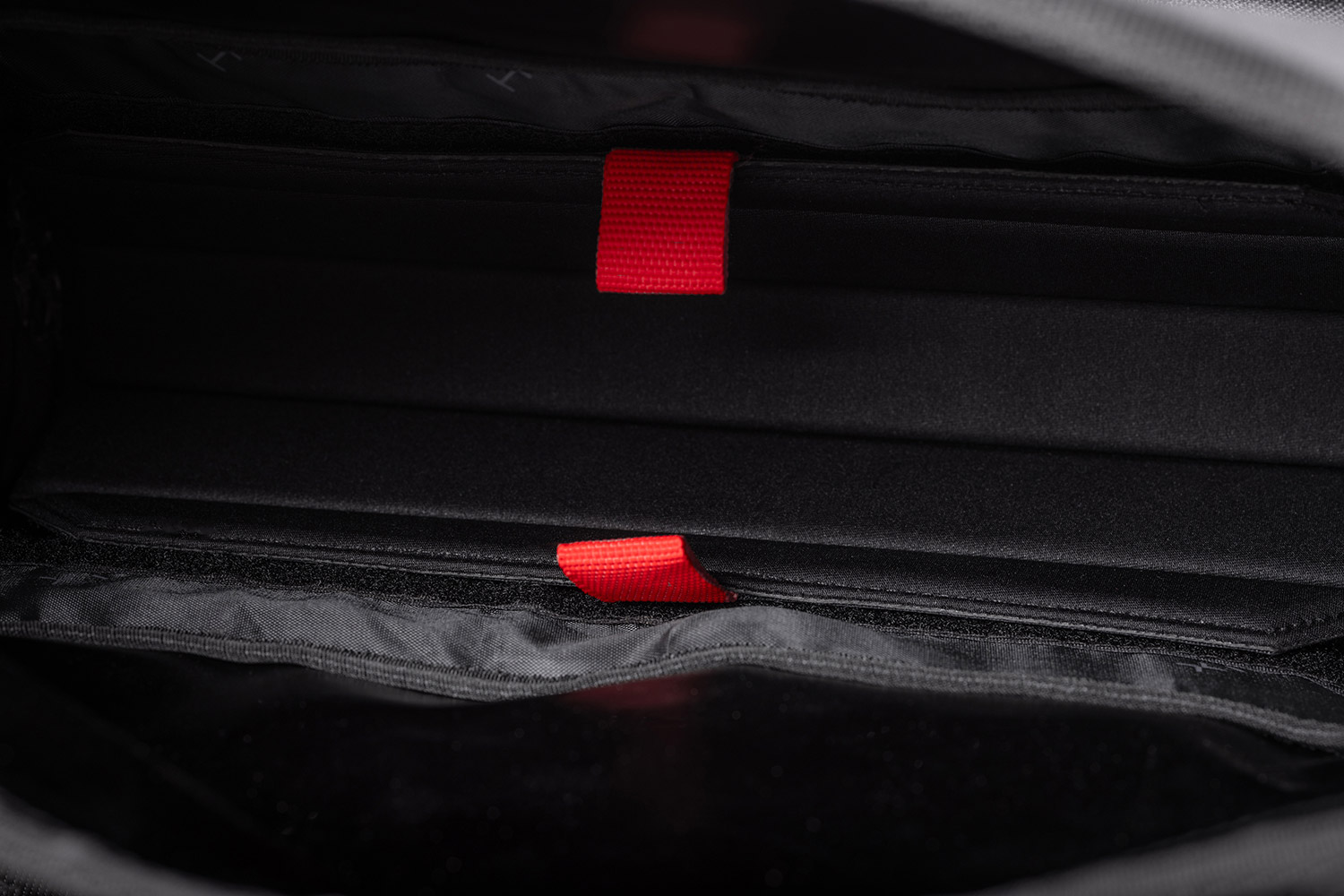 Close-up view of the divider in the main compartment of the Helix Stadium Backpack