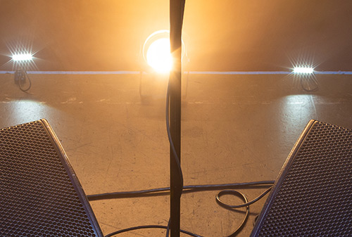 cut up image with top part of stage monitor and microphone stand