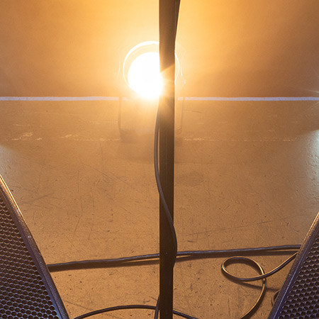 cut up image with top part of stage monitor and microphone stand