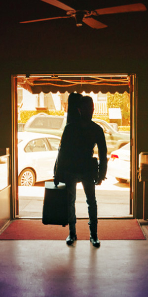 Part 2 cut up image with musician in bar entrance with Powercab and guitar