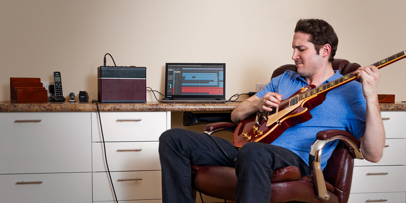 Guitarist recording via USB with a Line 6 AMPLIFi 30 guitar amp with amp and effects models
