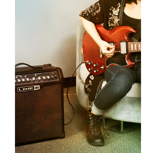 guitar player practicing on Line 6 Spider IV amp
